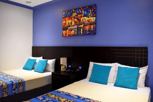 Postel nebo postele na pokoji v ubytování Hotel Del Centro