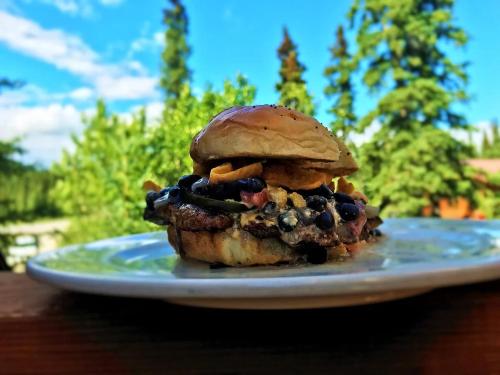 a sandwich on a plate on a table at McKinley Creekside Cabins in McKinley Park