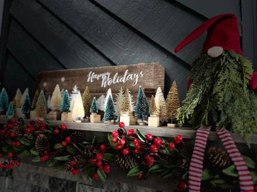 a christmas display of christmas trees and a sign at Comfy Condo With Amazing View of Gatlinburg and the Smokies in Gatlinburg