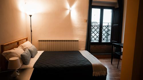 Postel nebo postele na pokoji v ubytování arco augusto