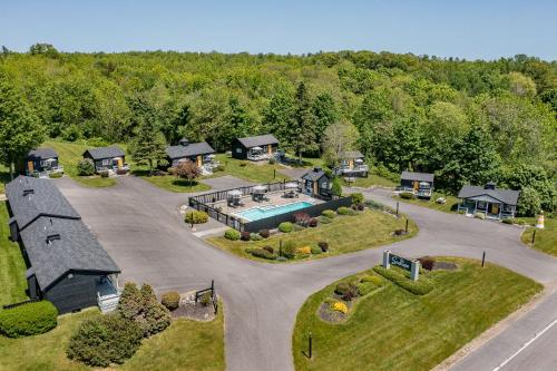 an aerial view of a house with a swimming pool at Seascape Motel & Cottages in Belfast