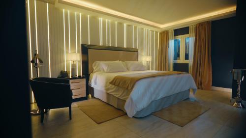 Ένα ή περισσότερα κρεβάτια σε δωμάτιο στο HT Hotel Deluxe Resort & SPA