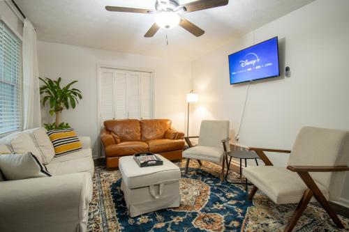 a living room with a couch and a table at Home Away in Taylors by Brick and Home in Taylors