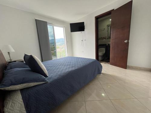 Ένα ή περισσότερα κρεβάτια σε δωμάτιο στο Penthouse San Rafael