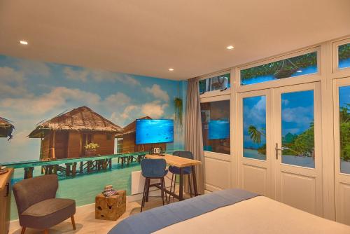 a bedroom with a wall mural of a resort at Heaven in East B&B in Amsterdam