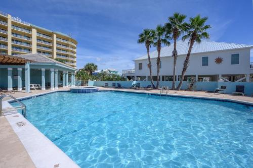 a large swimming pool in front of a hotel at Pet Friendly Ft Morgan Beach Home w/ Views! in Gulf Shores