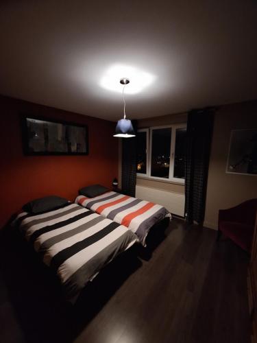 Ένα ή περισσότερα κρεβάτια σε δωμάτιο στο Le Dépôt