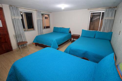 Postel nebo postele na pokoji v ubytování Hostal Plaza by Elvita