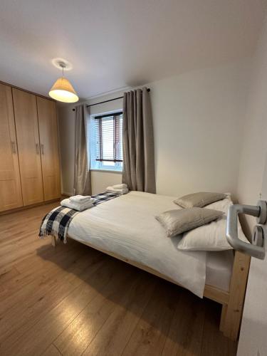 a bedroom with a large bed in a room at Stunning City Centre Apartments in Waterford