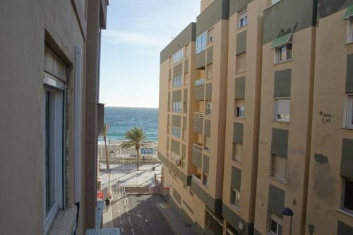 a view of the ocean from a building at Piso acogedor a 50m de la playa in Almería