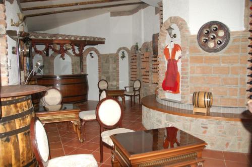 a room with a woman in a dress on a wall at Millenium Palace in Ohrid