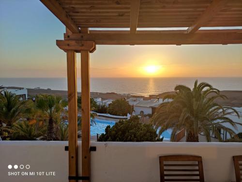 a view of the sunset from the balcony of a resort at The Sunset in Betancuría