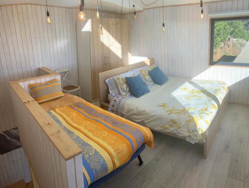 Postel nebo postele na pokoji v ubytování Beach escape to Pichilemu - Not so tiny house