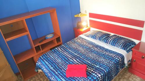Una cama o camas en una habitación de Margaritas Hostel