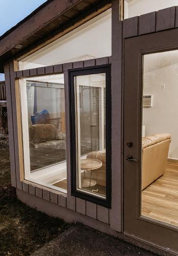 a house with two windows and a living room at Irish Mountain Suites in Meaford