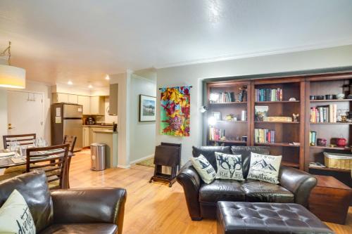 a living room with leather furniture and a kitchen at Cozy Condo with Fireplace - Near Brian Head Resort! in Brian Head