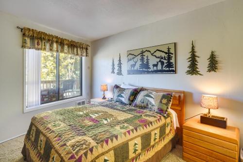 a bedroom with a bed and a window at Cozy Condo with Fireplace - Near Brian Head Resort! in Brian Head