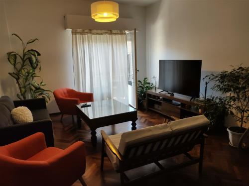TV a/nebo společenská místnost v ubytování Habitación Privada