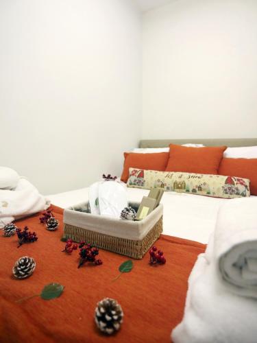 a room with a bed with a box of jewelry on the floor at Psimithefto Luxury Apartments in Thessaloniki