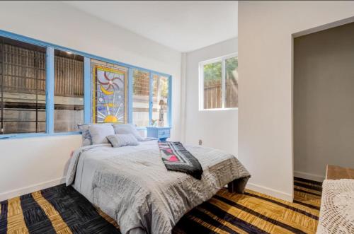 a bedroom with a bed and a window at Hillmont paradise in Oakland