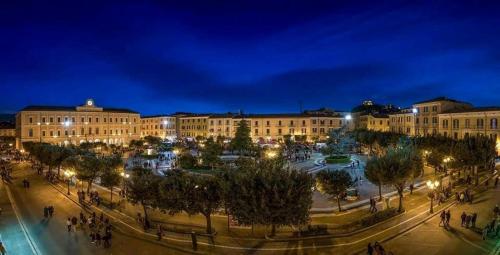 a large building with lights in a city at night at B&B Ciocca I in Campobasso