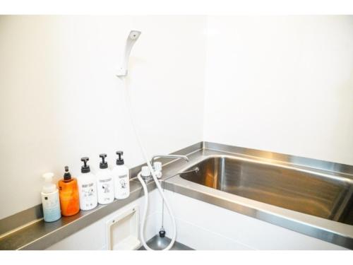 a kitchen counter with a sink and a sink at ONE Hostel Himeji - Vacation STAY 98707v in Himeji
