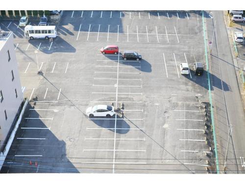 an overhead view of a parking lot with cars parked at Hotel 1-2-3 Maebashi Mercury - Vacation STAY 01042v in Maebashi