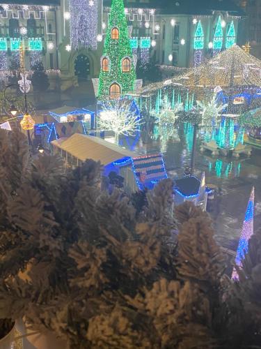 a christmas display in a building with christmas lights at Black&White Studio Ultracentral in Craiova