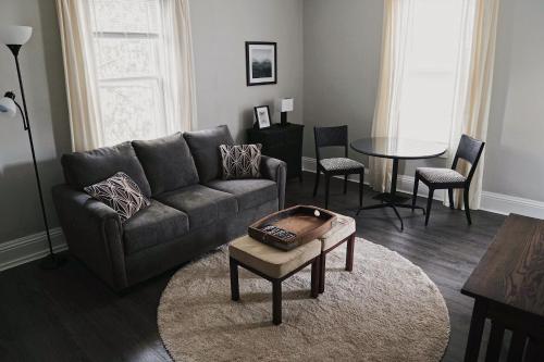 a living room with a couch and a table at The Trafalgar in Oakville