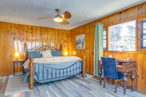 a bedroom with a bed and a desk and a chair at Charming Idaho Springs Retreat on Chicago Creek! in Idaho Springs