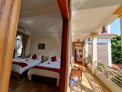 Postel nebo postele na pokoji v ubytování Phi Hung's Unique Homestay