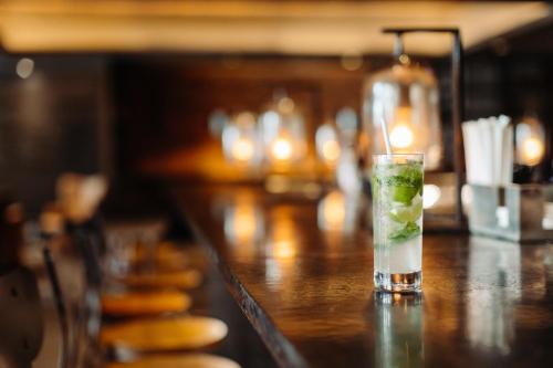 a drink sitting on a bar with a candle at Baltimore Marriott Waterfront in Baltimore