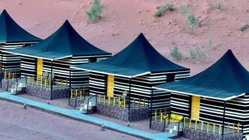 an overhead view of a building with blue roofs at RUM STARDUST lUXURY CAMP in Wadi Rum
