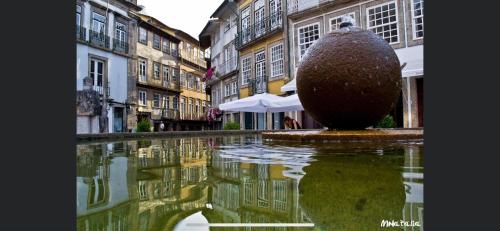 a pool of water in the middle of a street at FERREIRA'S HOUSE Guimarães in Guimarães