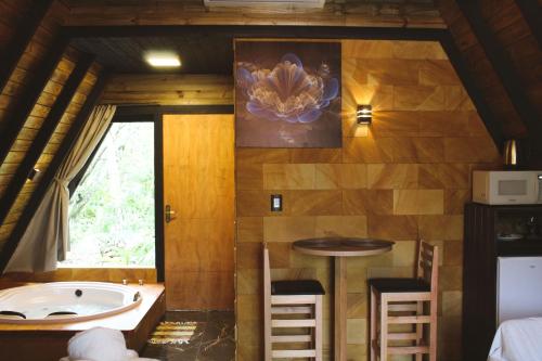 Φωτογραφία από το άλμπουμ του Chalé Suiço com Hidromassagem e café da Manhã σε Praia Grande