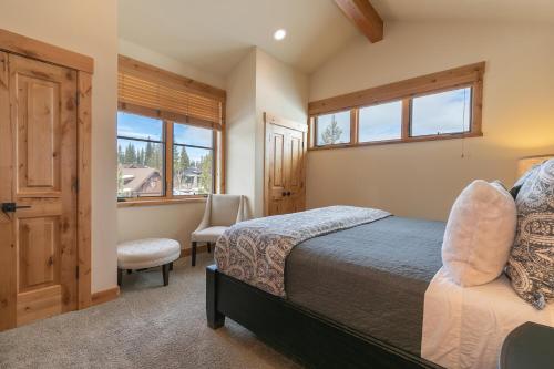 a bedroom with a bed and a window at Trestlewood Lodge at Schaffers Mill - Gorgeous 3 BR w Golf Course Views - Extended Stays Welcome! in Truckee
