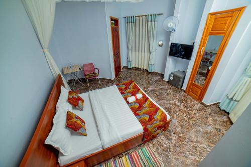a bedroom with a bed in a room at Entuiga cottages in Hoima