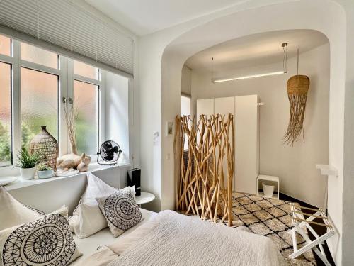 a bedroom with a bed and a window at Cocoma-Design-Apartment Deluxe - very central in Munich