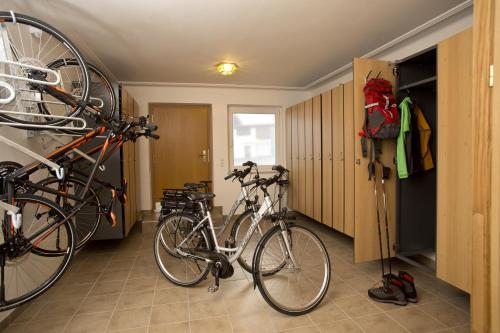 two bikes are parked in a room at Hotel in the HEART of the Alps in Uttendorf