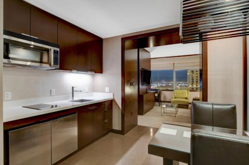 a kitchen with a view of a living room at Vdara Hotel & Spa in Las Vegas