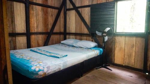 En eller flere senge i et værelse på Pacific Dream Hostal