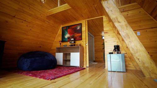 a room with a large bean bag chair in a cabin at ANUK CHOCONTA in Chocontá