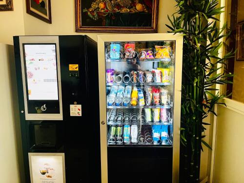 a refrigerator filled with lots of bottles of water at Art House in Alicante