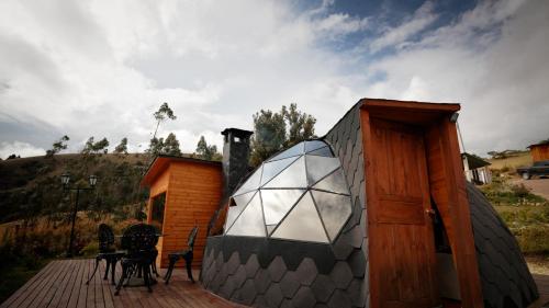 a small house with a glass dome on a deck at ANUK CHOCONTA in Chocontá
