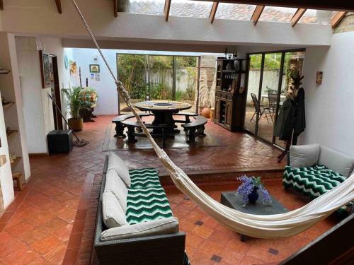 a living room with a hammock in a house at Agroturismo Villa Maria in Tuta
