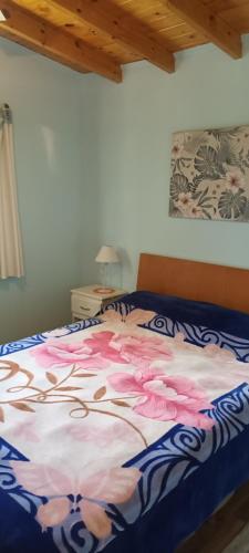 a bedroom with a bed with a colorful blanket at isla delta encantado in Tigre