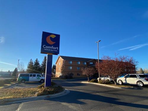 a sign for a car dealership in a parking lot at Comfort Inn & Suites Gunnison-Crested Butte in Gunnison