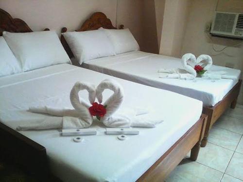 Tempat tidur dalam kamar di Adtempco bed and breakfast