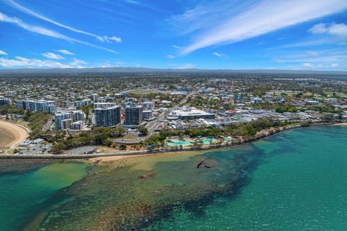 an aerial view of a beach and the ocean at La Vida on Anzac in Redcliffe