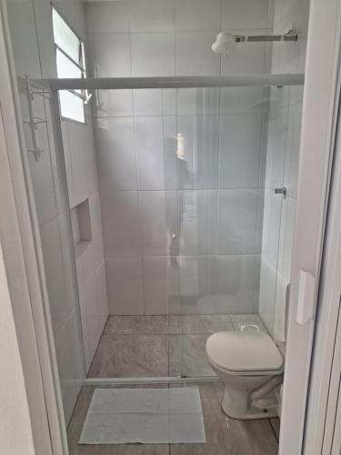 a bathroom with a shower with a toilet at Araçariguama in Araçariguama